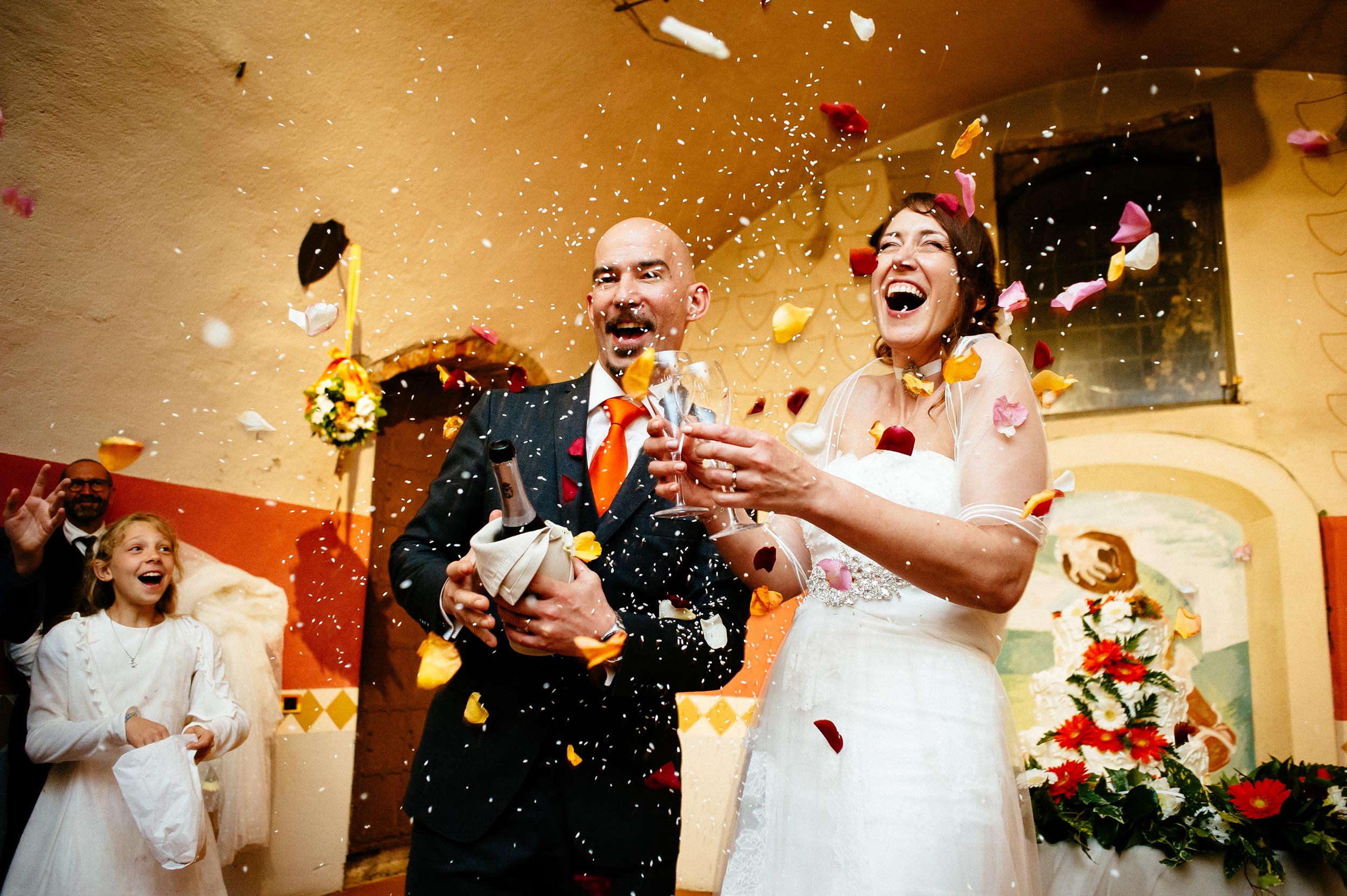 wedding toast with rice and petals confetti explosion