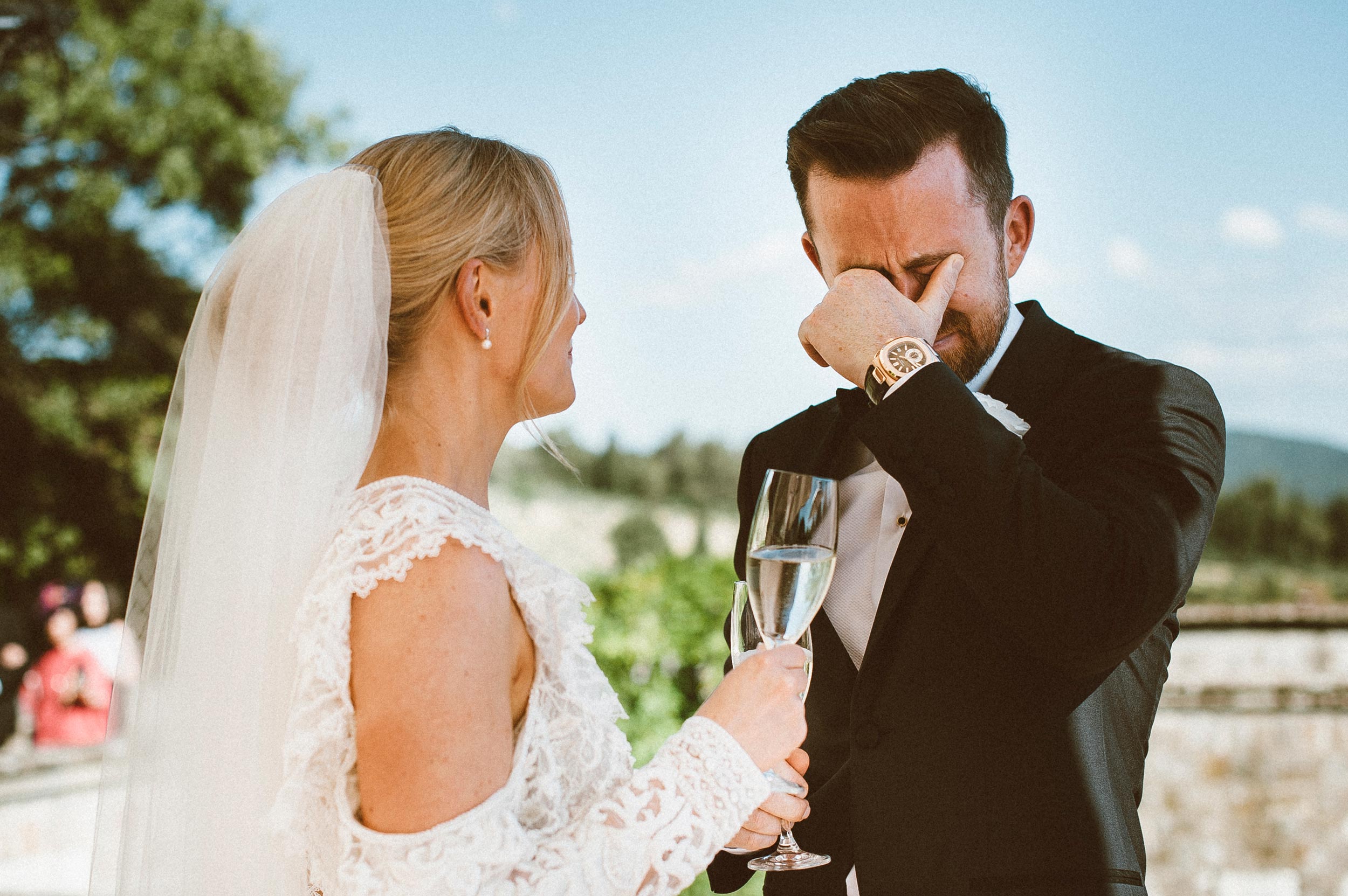 moved groom crying strong emotion in front of the bride candid documentary wedding photography by Alessandro Avenali
