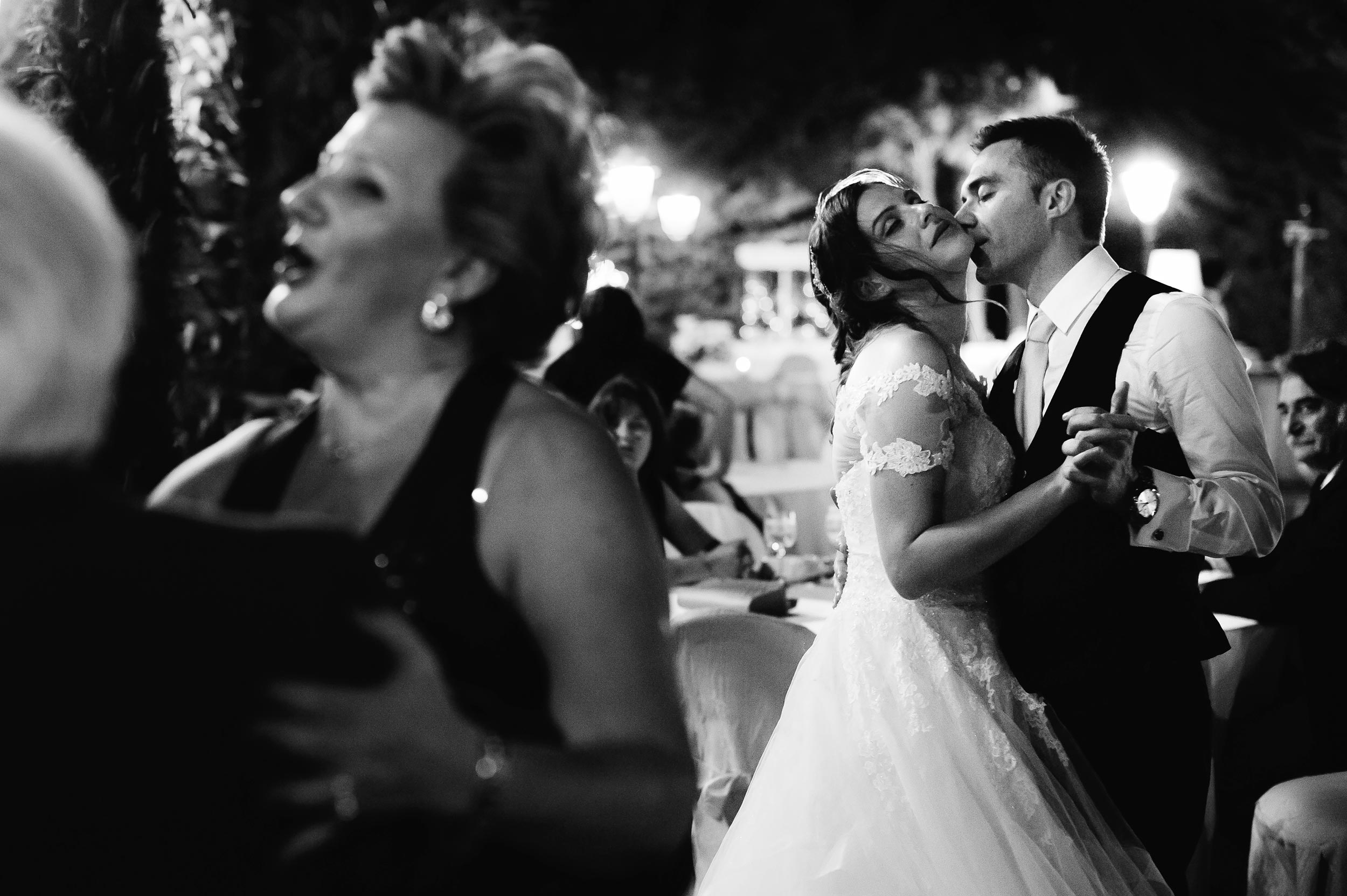 bride and groom romantic dance during the reception black and white wedding photography
