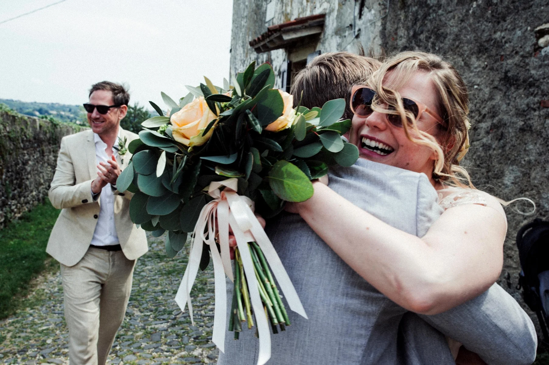 bride smiling with husband in background wedding photographer Venice Italy
