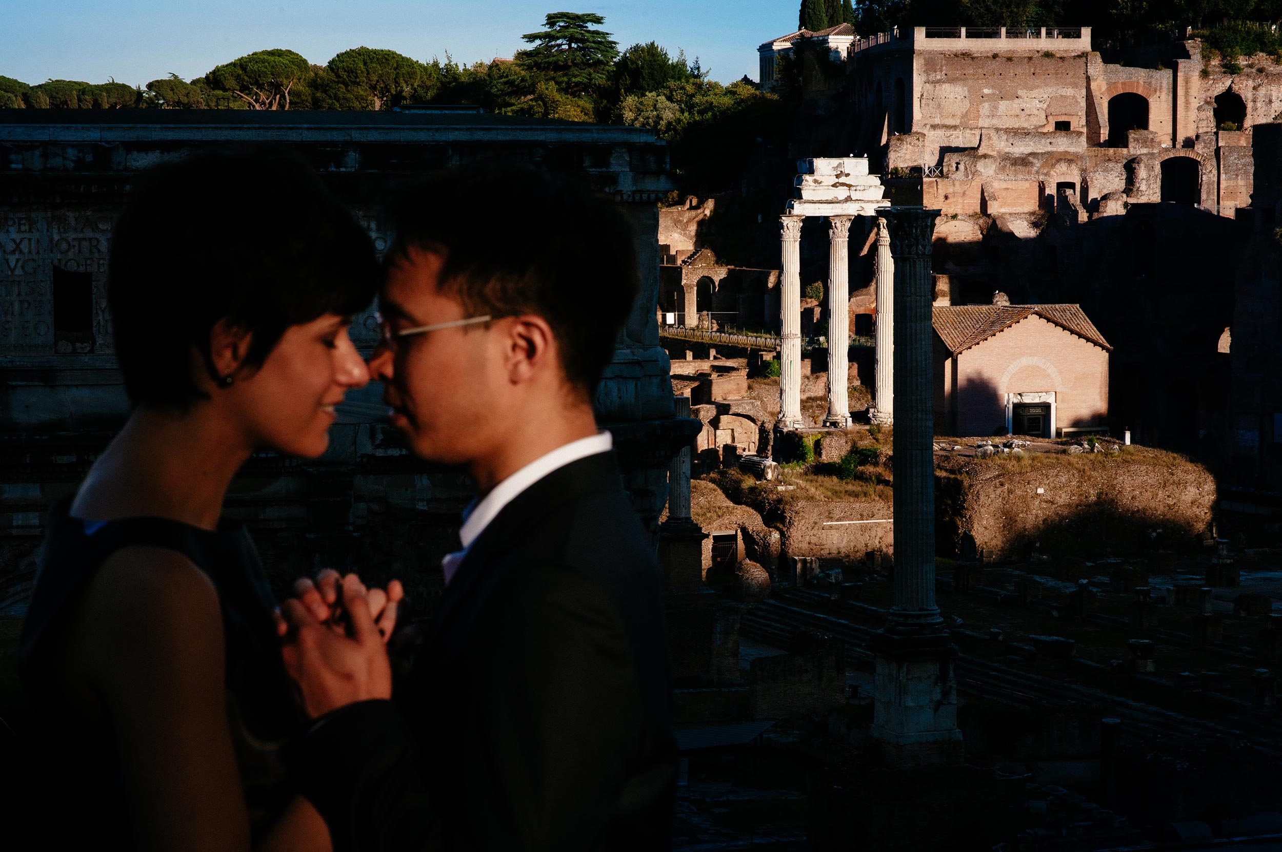 Romantic honeymoon portrait at Rome Imperial Forum at sunset