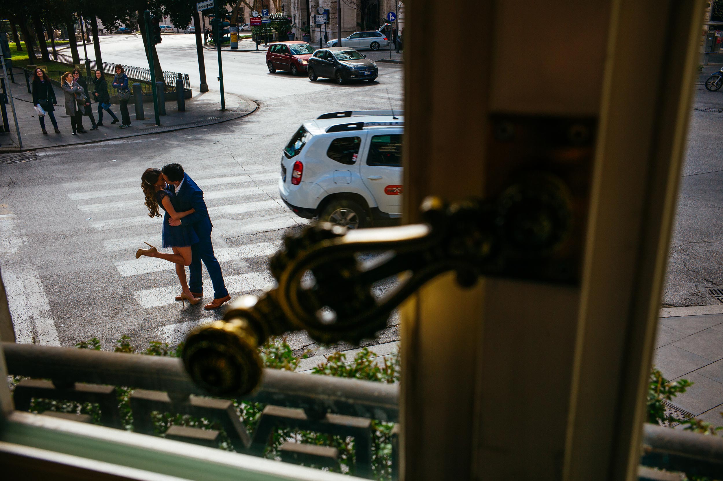 Engagement in Rome - couple kissing on pedestrian stripes