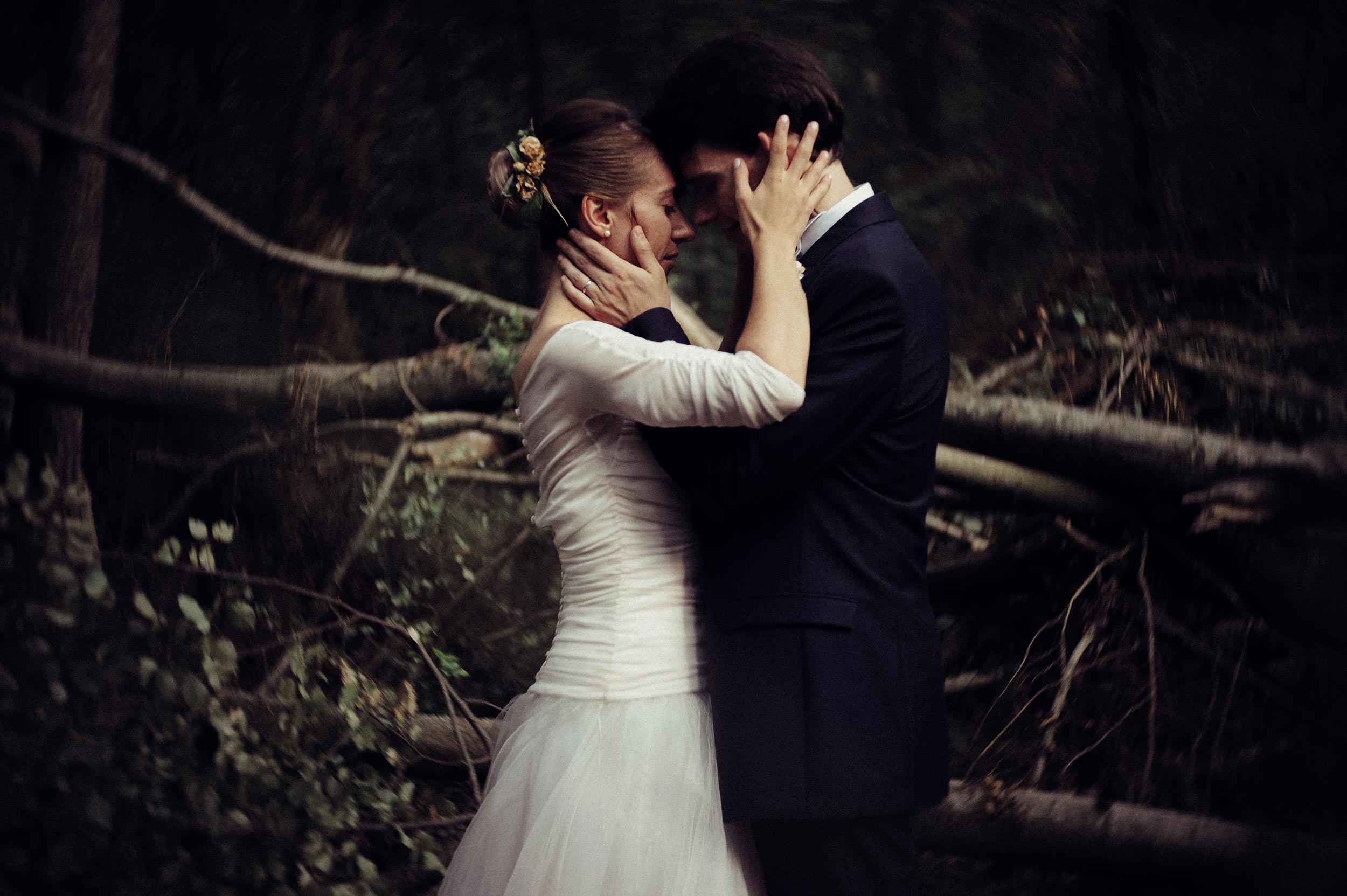 romantic orange teal bride and groom portrait in the woods looks like film