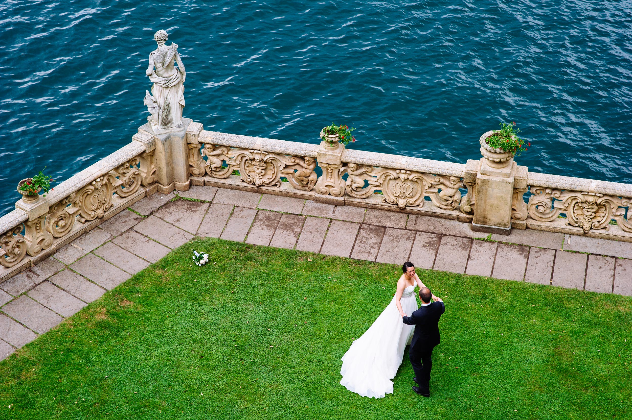 bride and groom dancing balcony Villa Del Balbianello Bellagio Lake Como Wedding Photographer Italy Alessandro Avenali