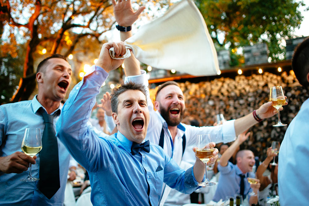 Friends partying at the wedding reception